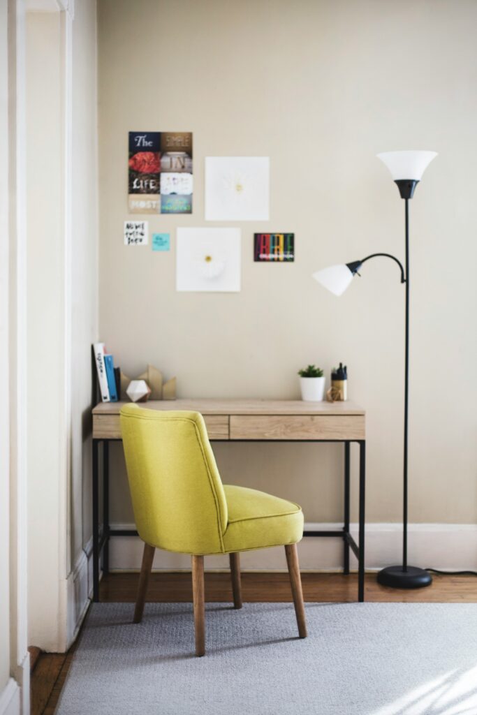 writing space with a yellow chair and a desk